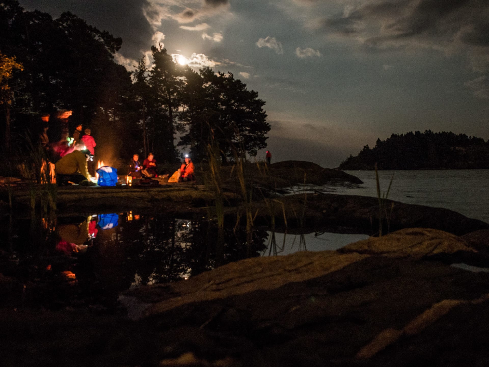 A group gathered around the campfire